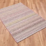 An outdoor rug with a bohemian inspired multicolored pattern