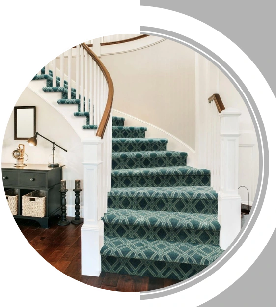 Blue and green patterned carpet on a curved staircase