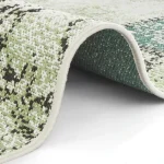 The Carpet has a slightly curled edge revealing a white backing